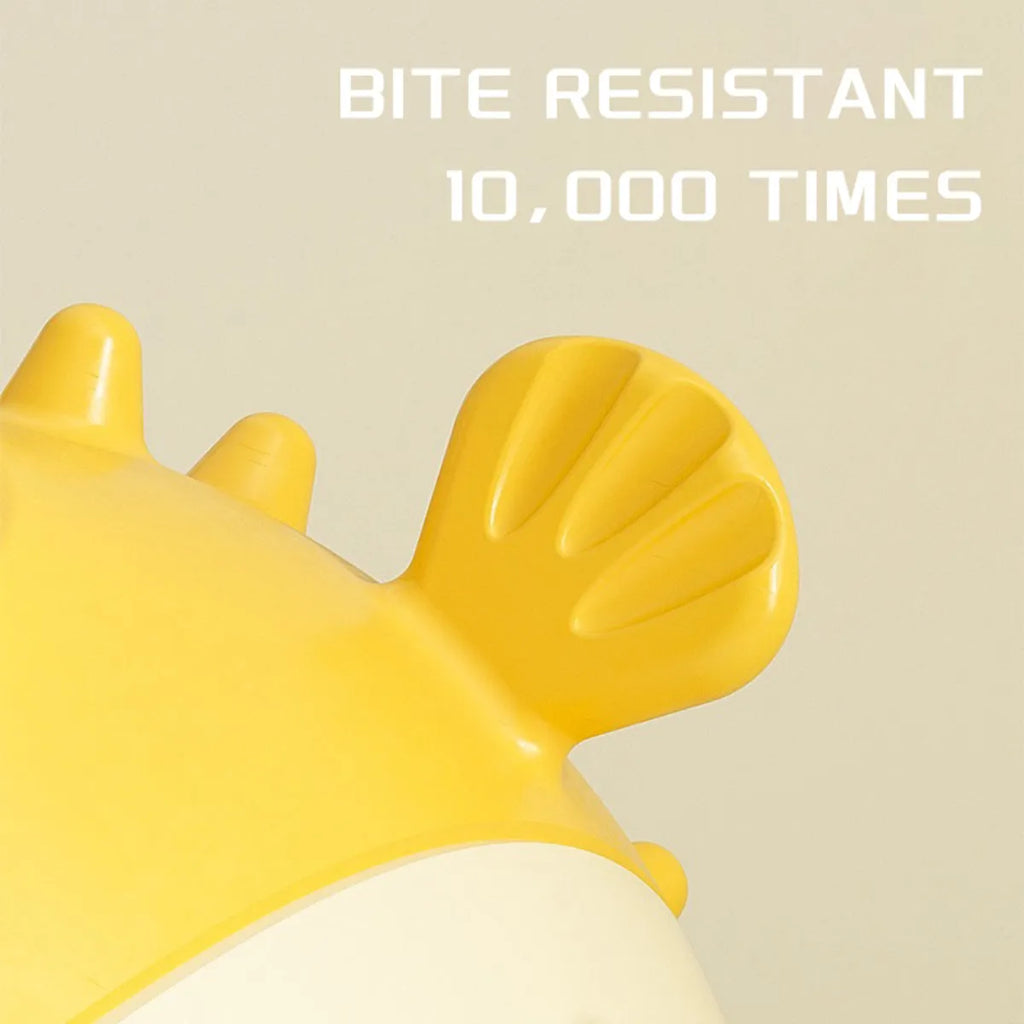 Yellow vinyl fish-shaped squeaky dog chew toy on a plain background