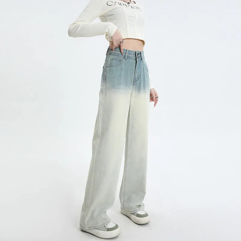 Gradient blue straight-leg women's jeans on a neutral background showing the colour transition.