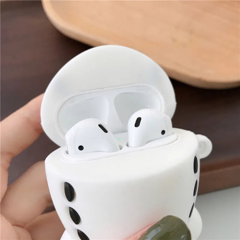Blue silicone flip case for AirPods with cartoon airplane design and metal carrying hook.