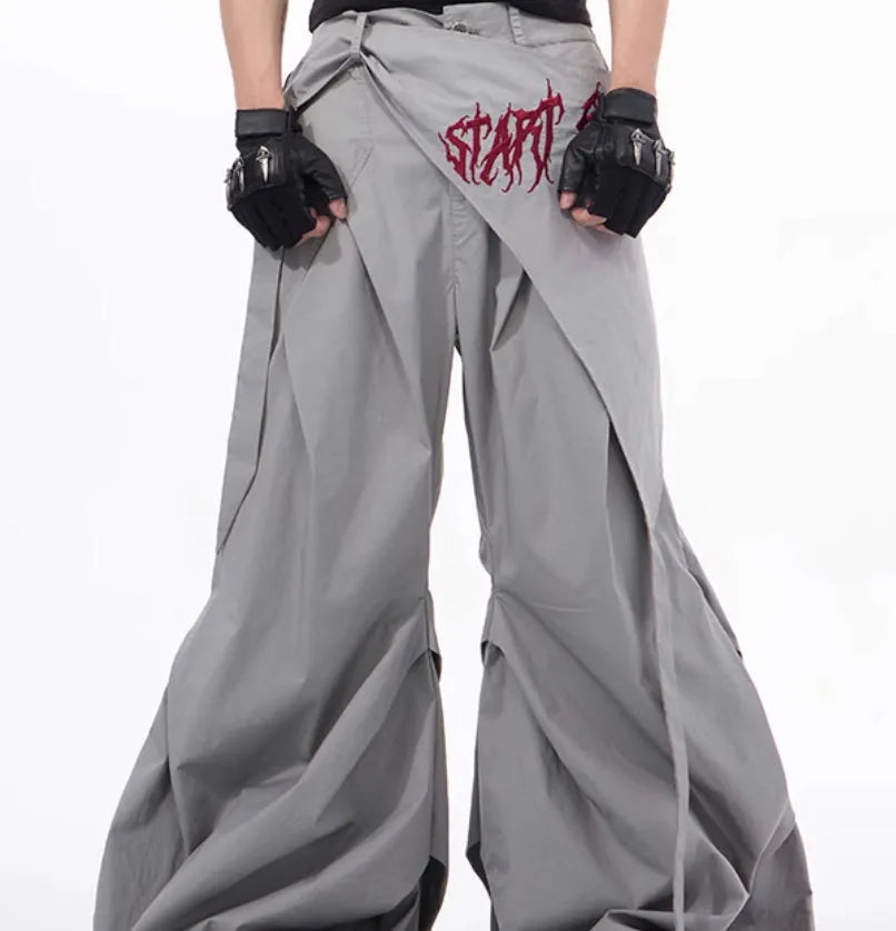 Boy wearing black wide-leg Korean style summer trousers with an elasticated waistband.