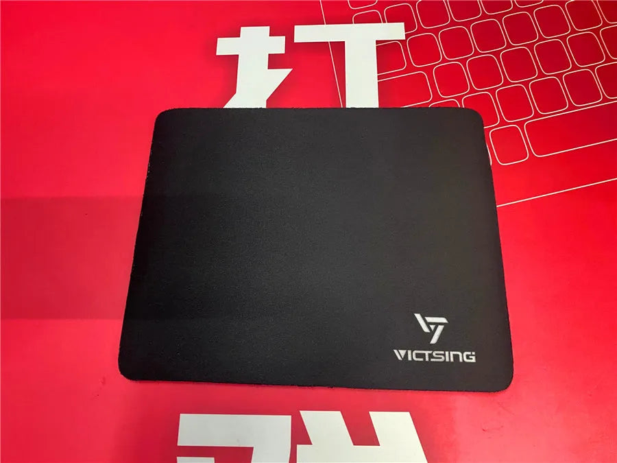 Black rough grain thickened mouse pad measuring 270x220mm with 5mm rubber base