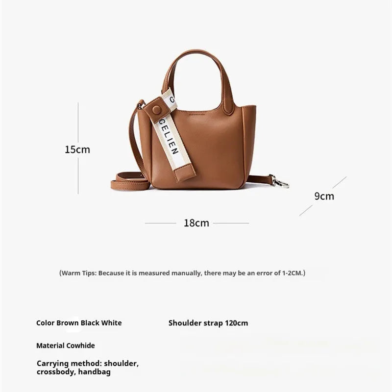 Brown cattlehide leather cross body bucket bag with square vertical design and slit pocket