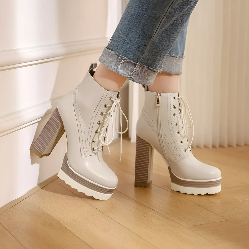 Women's black waterproof platform boots with chunky heel and side zipper closure
