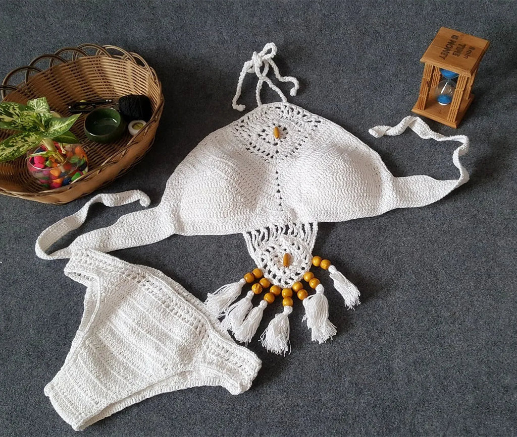 Crochet tassel bikini set for women in black, showing textured weave and tassel trim, beach style