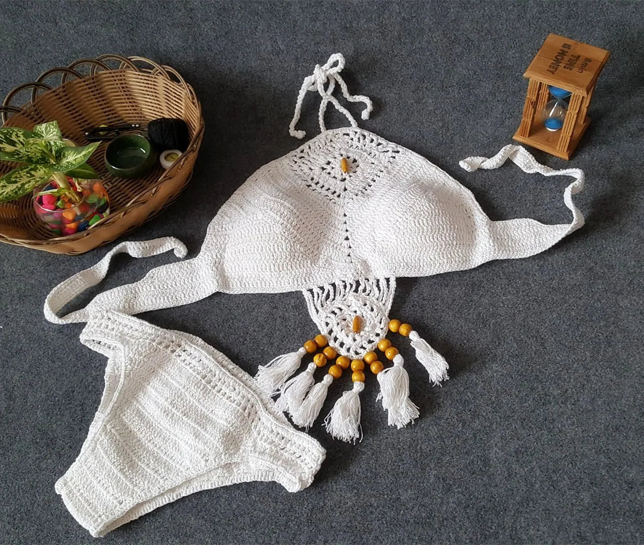 Crochet tassel bikini set for women in black, showing textured weave and tassel trim, beach style