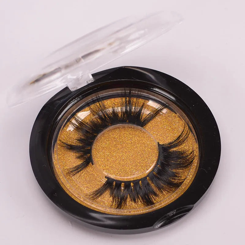A pair of Affectionate brand 5D false eyelashes made from mink hair, shown with a storage cap and double-headed brush.