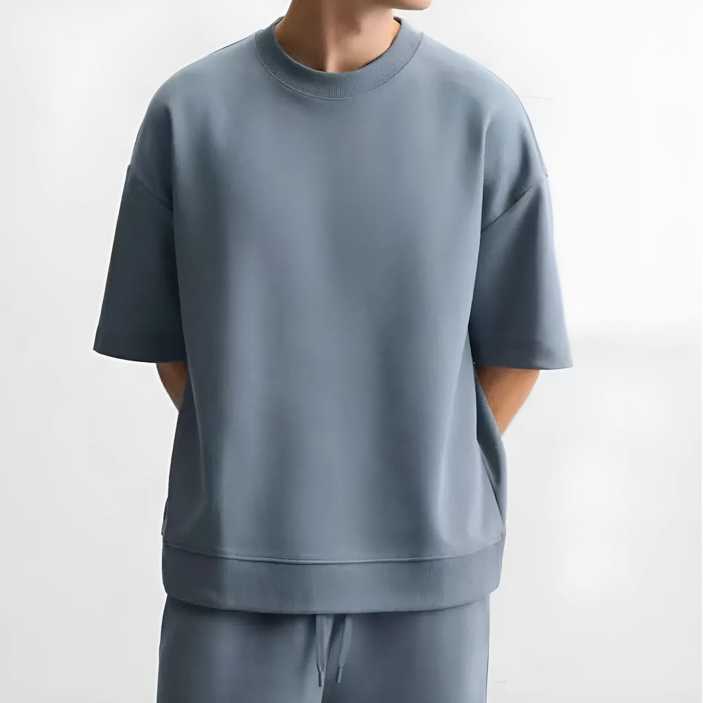 Loose-fit textured polyester short sleeve shirt and matching shorts set on a hanger, shown in a blue colour combination.