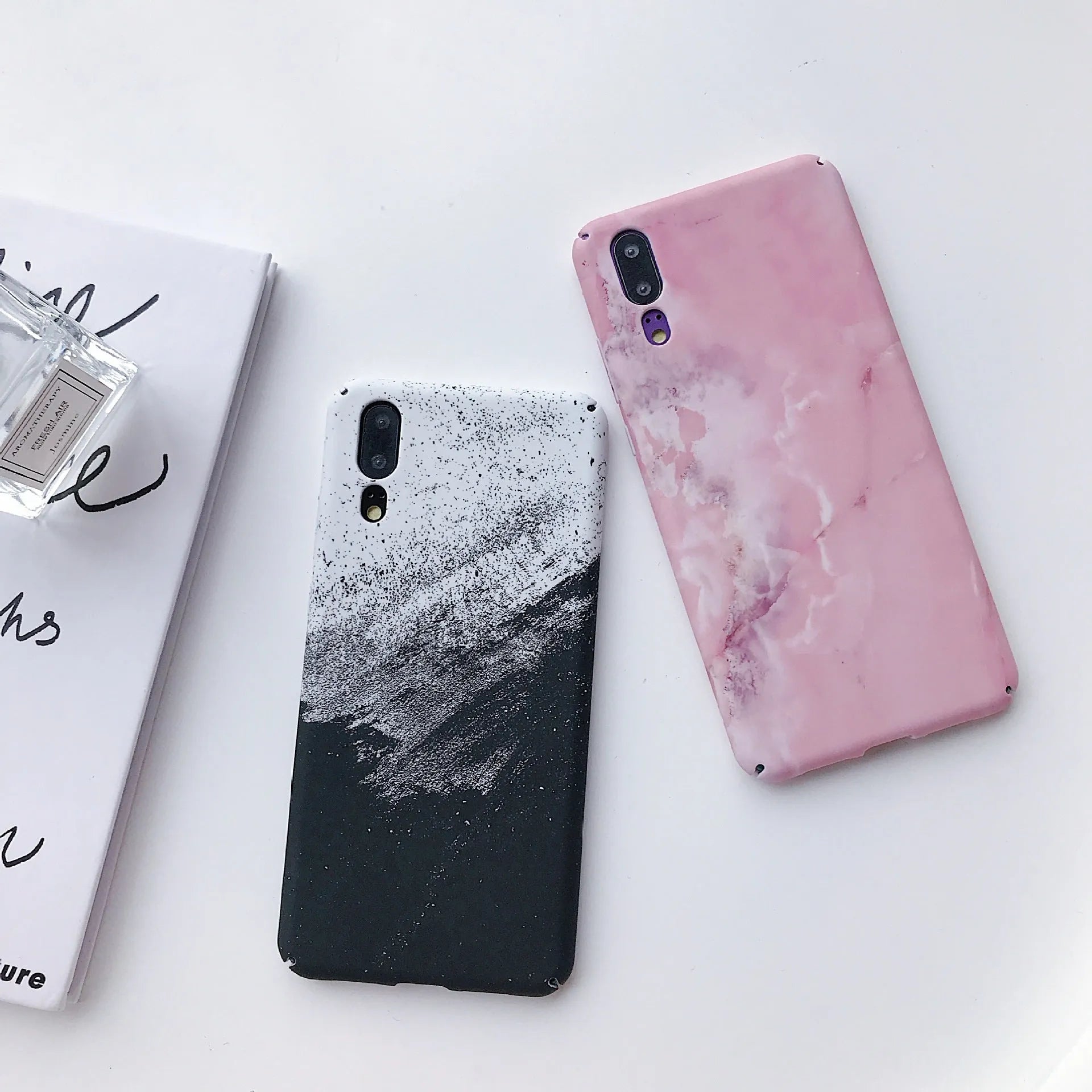Painted black and pink mobile phone back cover cases for Huawei and Honor models.