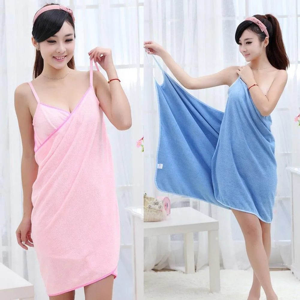 Pink beach dress towel worn as a cover-up, showing its long rectangular shape and soft texture.