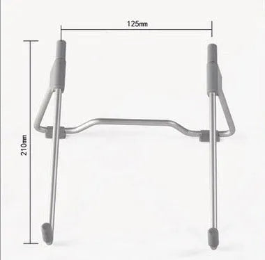 Grey foldable aluminium and plastic stand holding a mobile phone and a laptop on a desk.