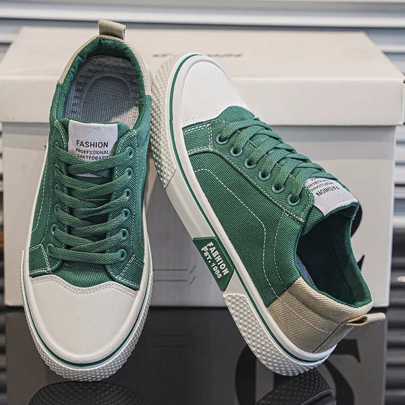 Men's low-top canvas skate shoes in blue with lace-up front and white PVC sole