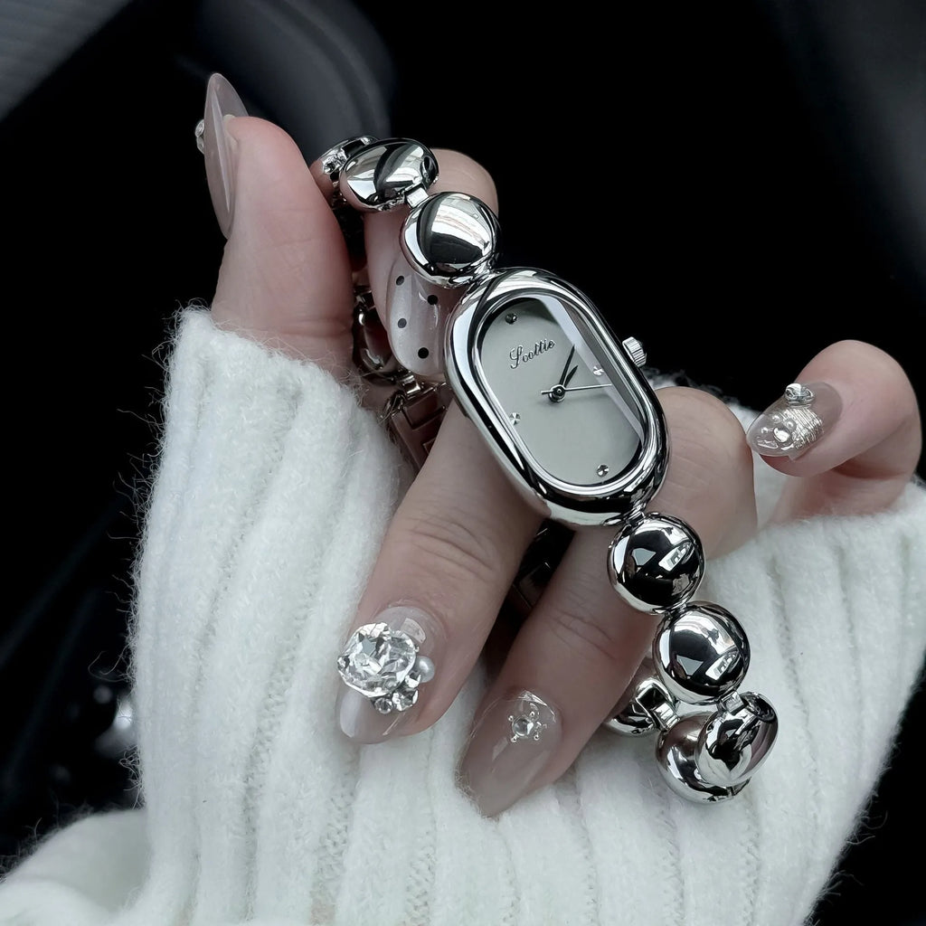 Oval women's watch with 9mm case thickness shown in multiple colour finishes