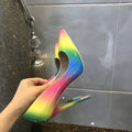 Rainbow coloured patent leather high heels with pointed toe and thin ultra-high heel