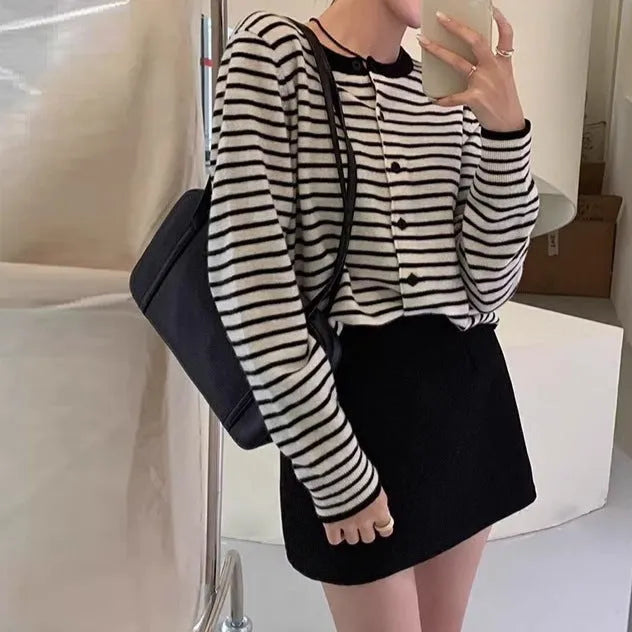 Dark grey and white striped women's slim-fit cardigan coat with long sleeves, shown on a model.