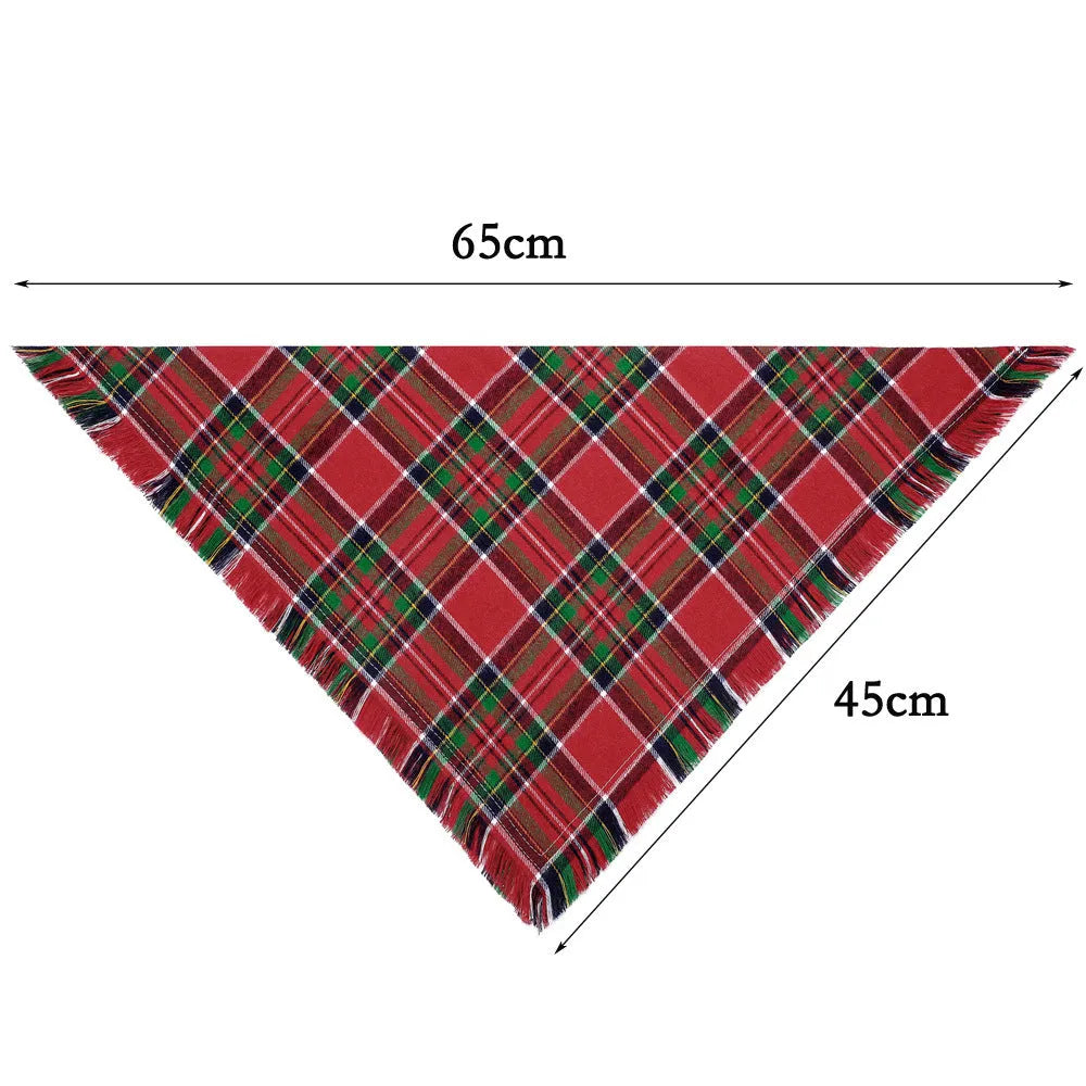 Brown, green, orange, red, and yellow plaid dog bandana with tassels on the edges.