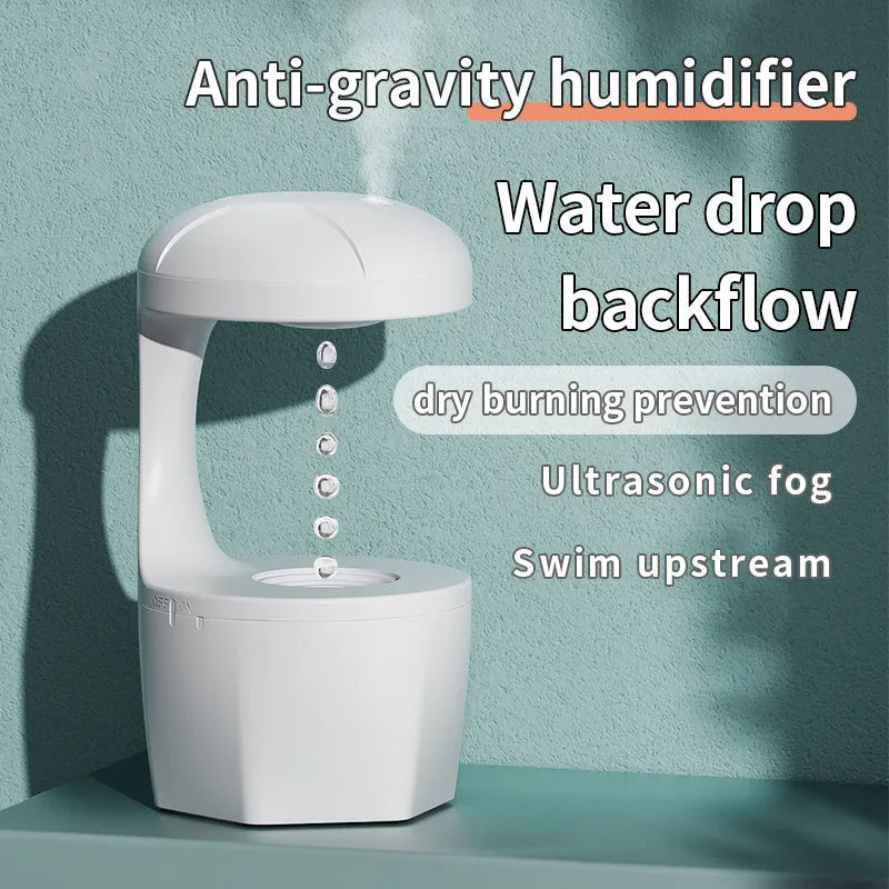 Portable white anti gravity USB cool mist humidifier with 800ml tank and droplet effect on a desk