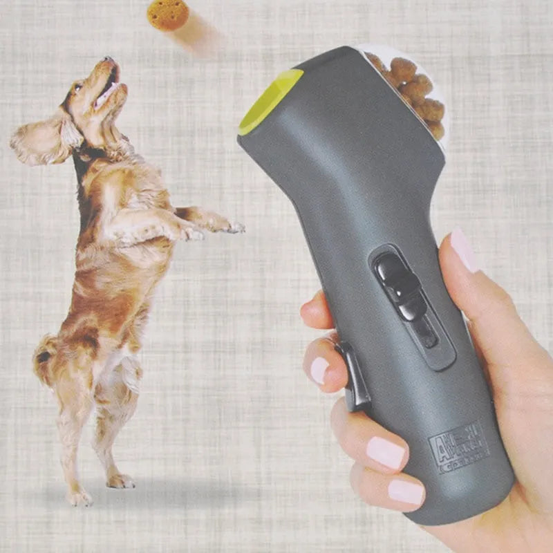 Grey plastic pet snack catapult launcher toy with a handle for dog and cat interactive training.