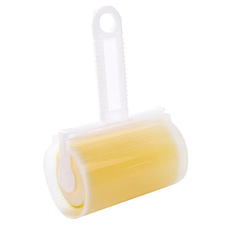 Set of four coloured washable reusable lint rollers with covers for removing pet hair.
