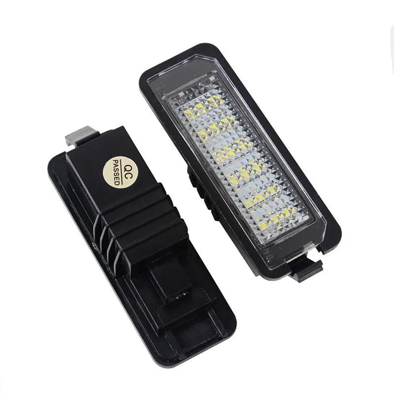 Two Volkswagen LED license plate light bulbs with SMD LEDs and plug connectors.