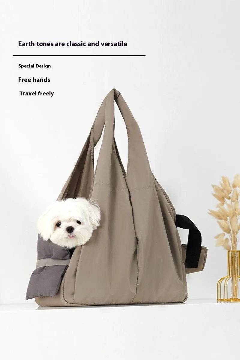 Apricot cloth pet carrier handbag for small dogs or cats, showing handle and breathable fabric.