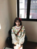 Milky white women's pullover sweater with lantern sleeves and a loose fit.