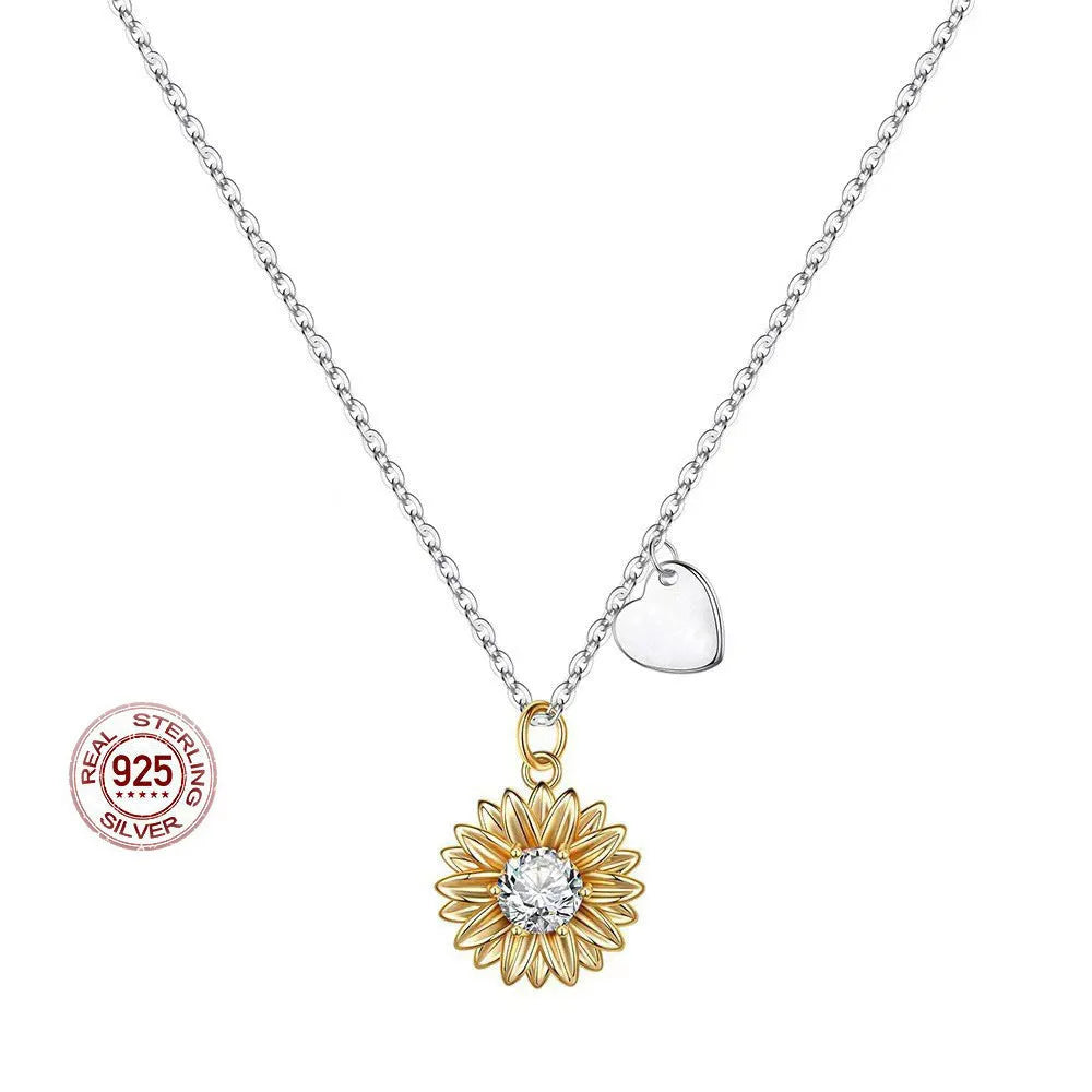 Geometric sunflower daisy pendant necklace on a silver cross chain, adjustable length.
