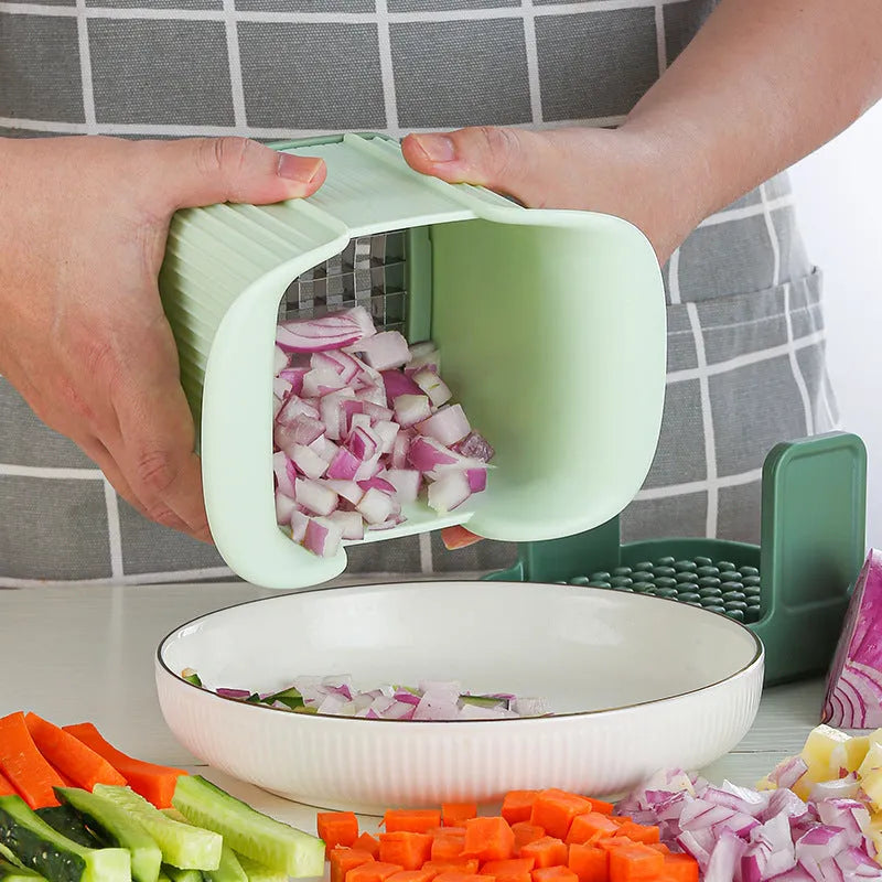 Green manual vegetable chopper for slicing onions, potatoes, radishes, and cucumbers with hand pressure operation