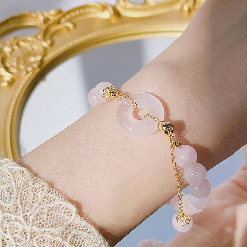 Pink crystal women's bracelet with peace buckle design and adjustable safety buckle closure