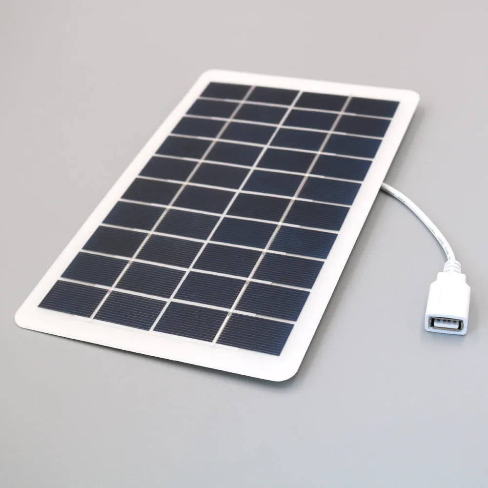 Black solar phone charging panel with USB port showing PET textured surface