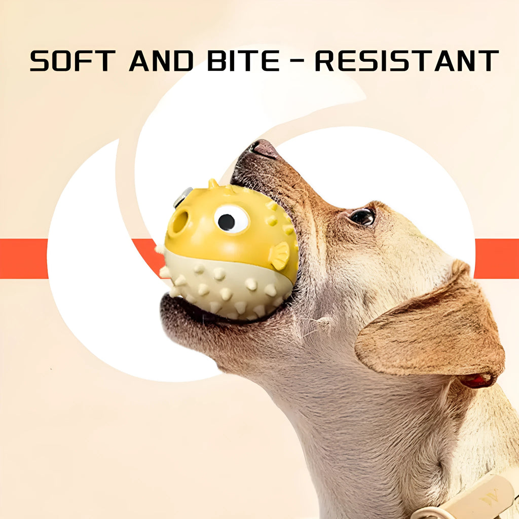 Yellow vinyl fish-shaped squeaky dog chew toy on a plain background
