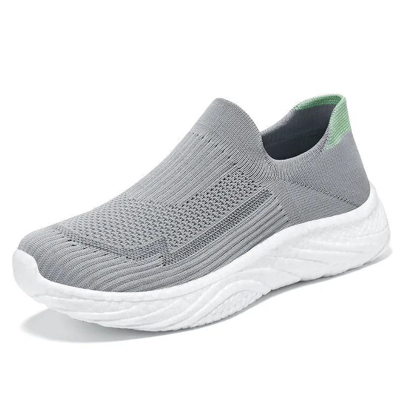 Flying woven casual shoes in black with low top, flat heel, and polyurethane sole, unisex design