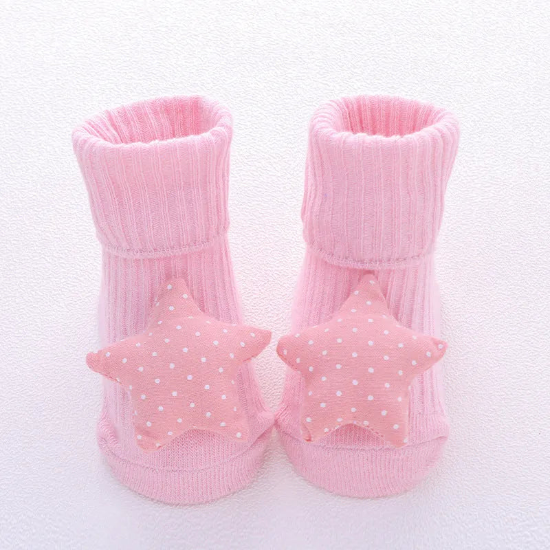 Cotton baby socks with non-slip soles in multiple designs including bows, stars, and animal prints.