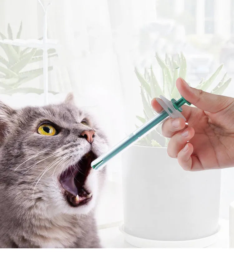 Two pet pill shooters with soft silicone tips for administering cat and dog medicine.