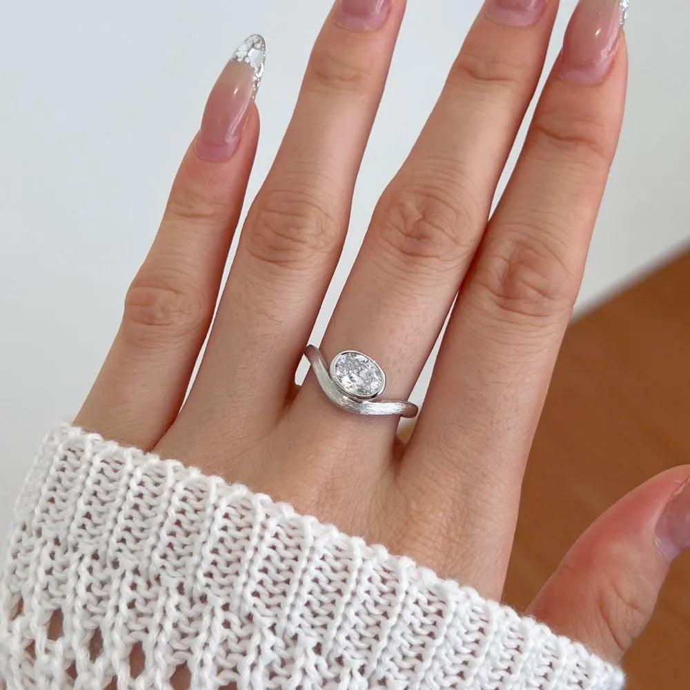 Women's simple oval silver ring electroplated platinum white diamond colour on white background