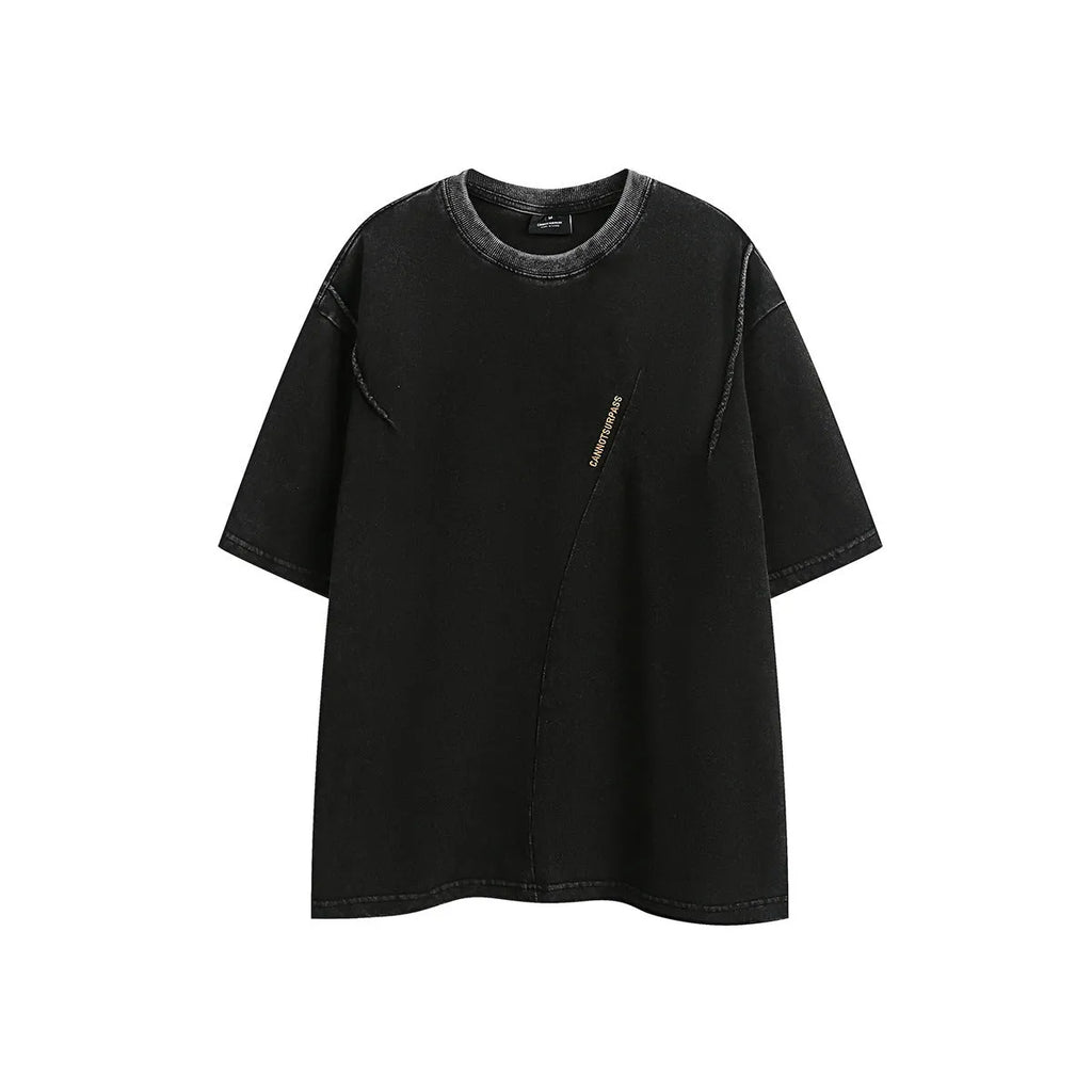 Man's purple loose-fit cotton t-shirt with a retro embroidered design on the chest.