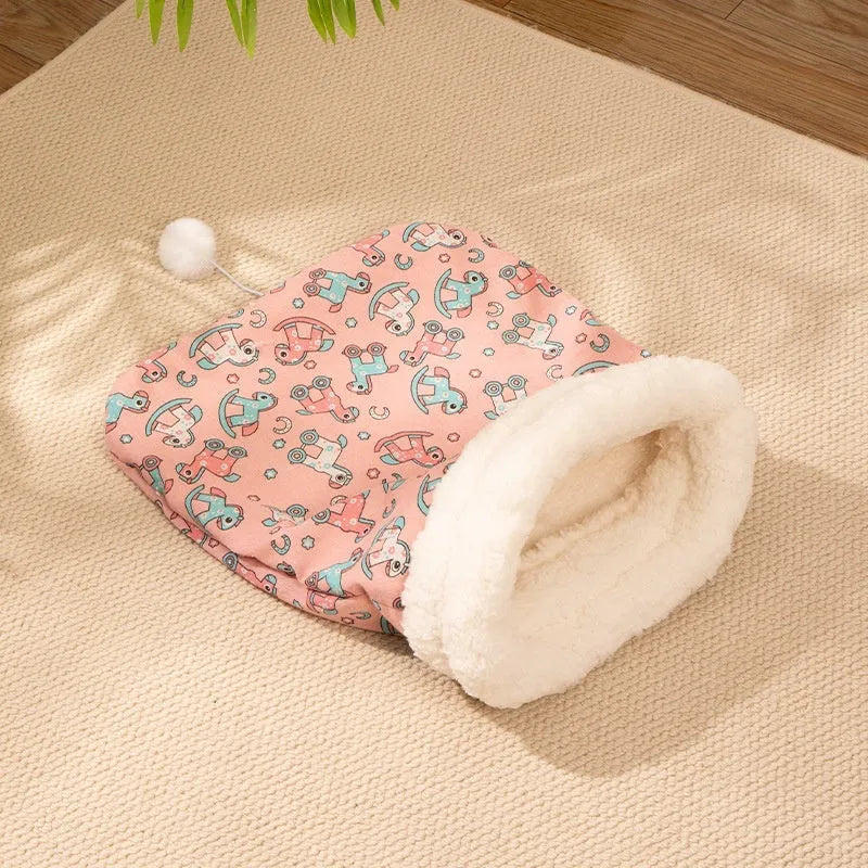 Flannel cat sleeping bag nest in pink Trojan design, showing cosy enclosed bed for pets.