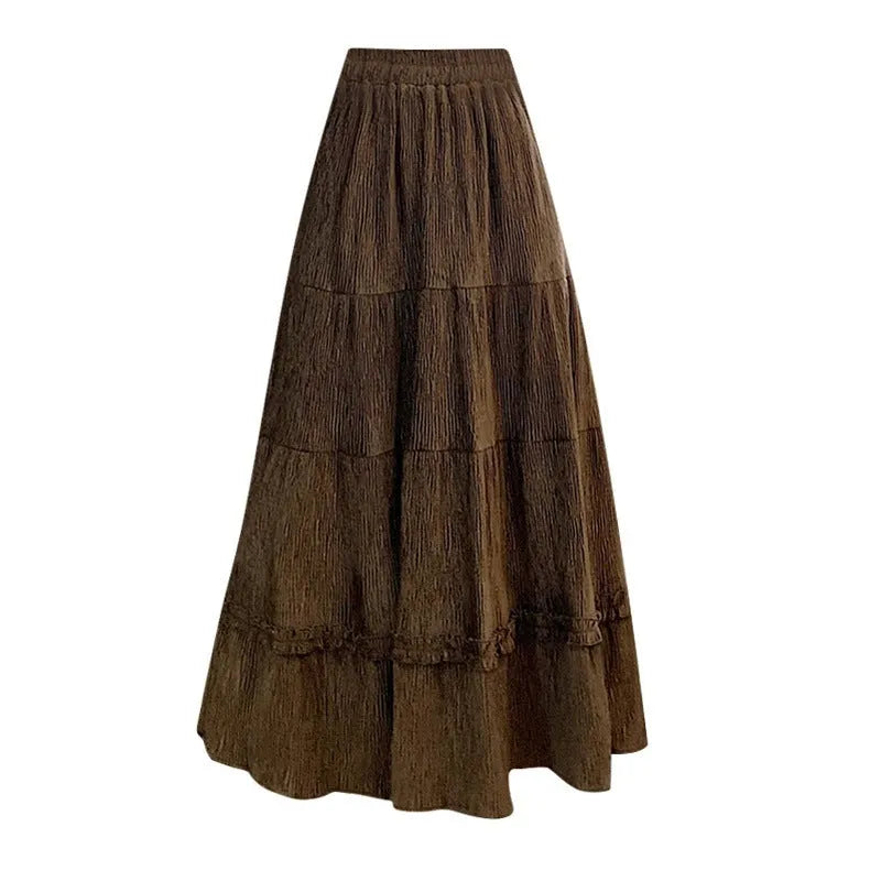 Beige corduroy A-line midi skirt with an elasticated waistband on a hanger.