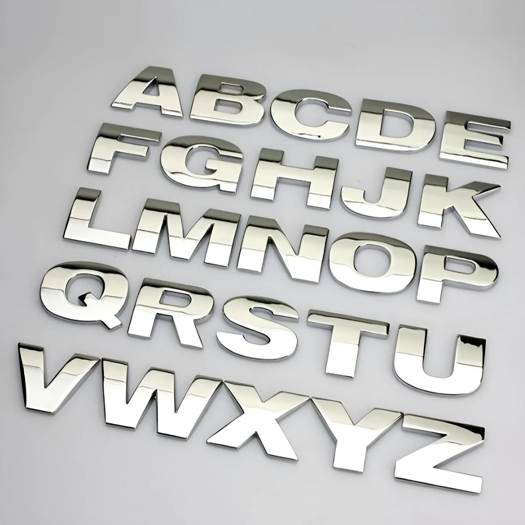 3D metal zinc alloy car bumper sticker showing raised letter A in silver finish, approximately 2.5cm in size.