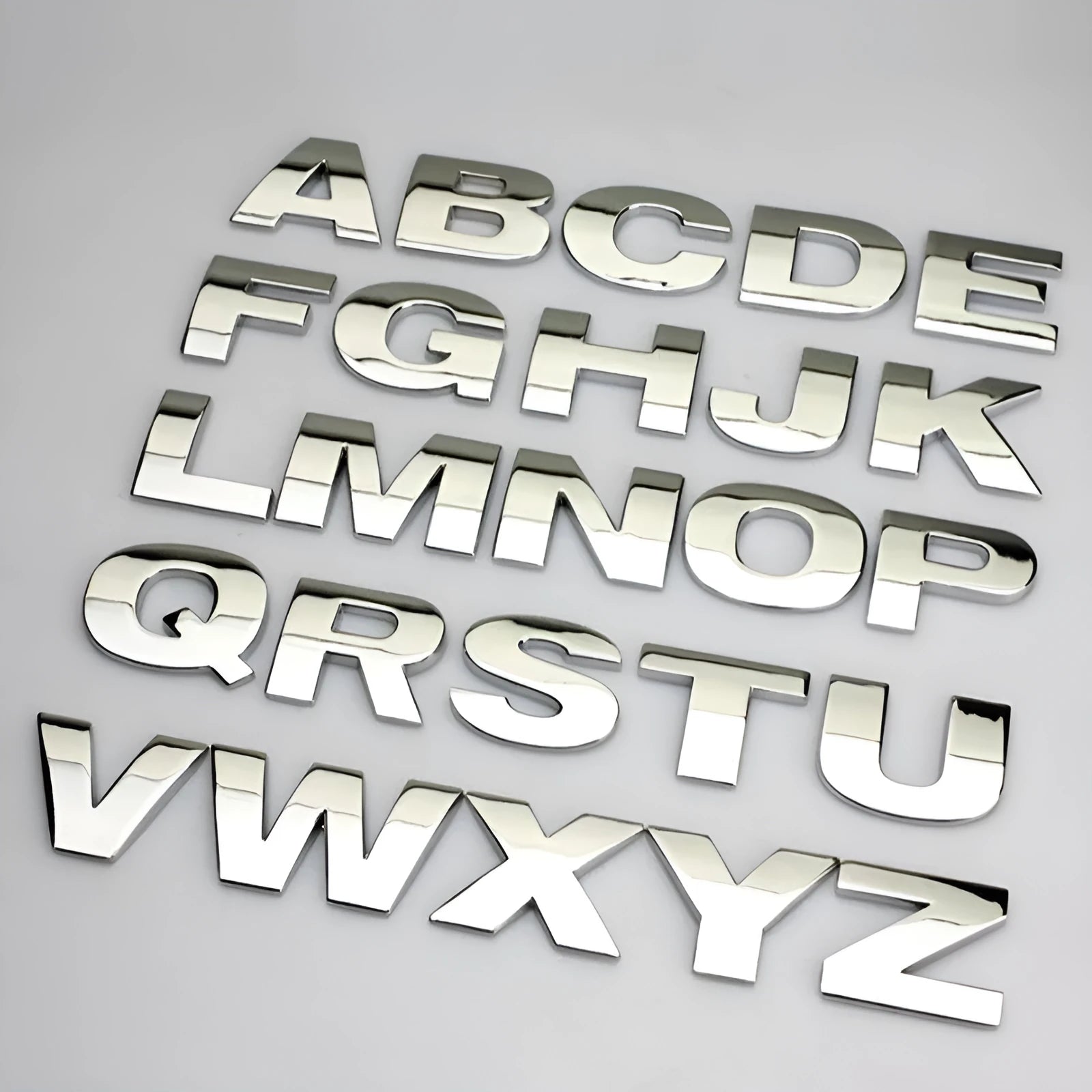 3D metal zinc alloy car bumper sticker showing raised letter A in silver finish, approximately 2.5cm in size.