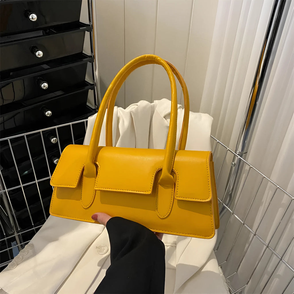 Women's horizontal square PU shoulder bag with stitching detail and single strap in black colour