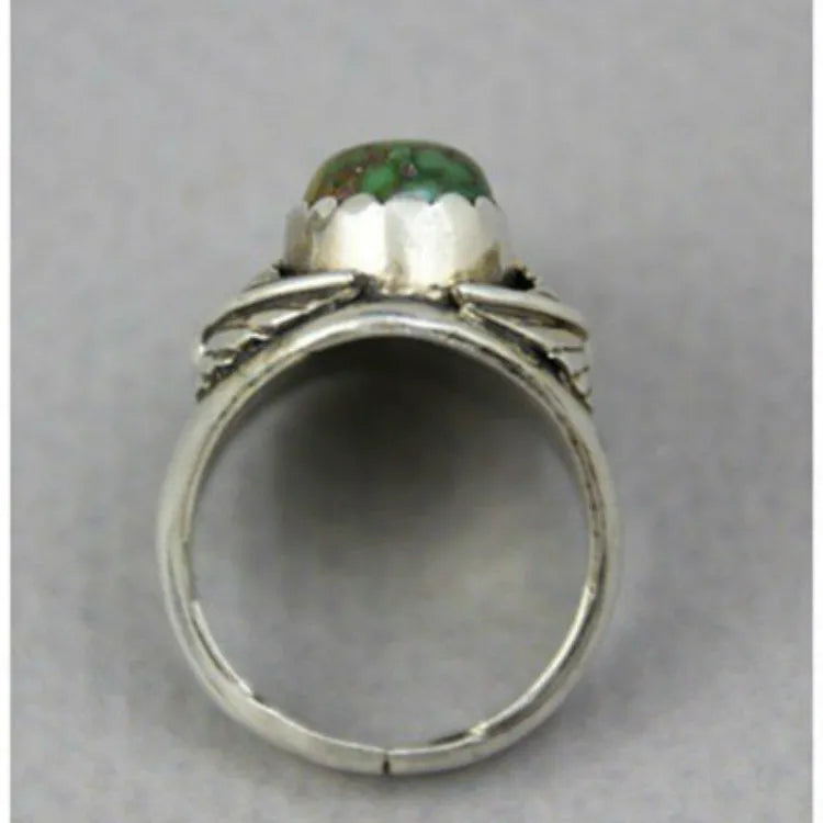 Turquoise geometric alloy ring with retro inlaid design on grey background