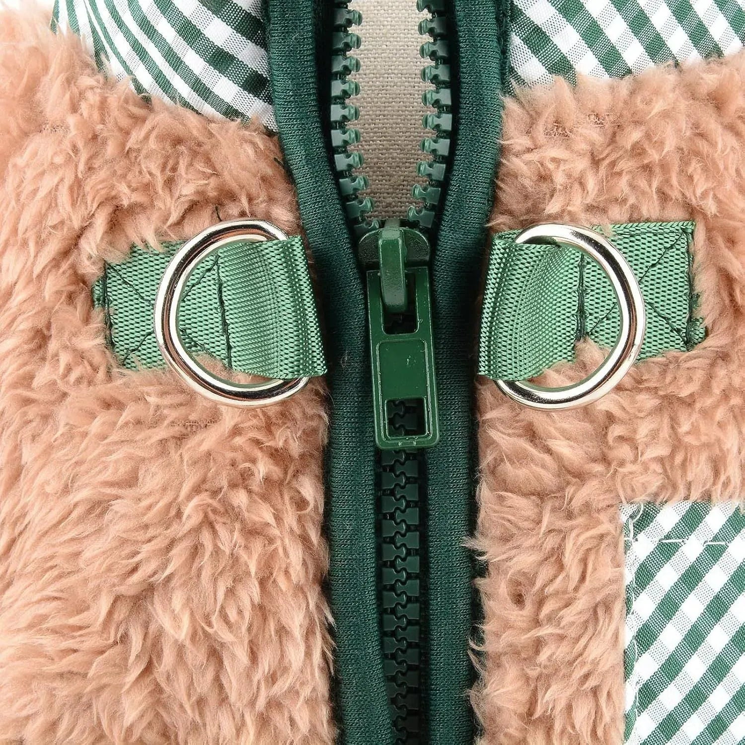 Small dog wearing a green fleece thermal jumpsuit coat with four legs and back zip closure.