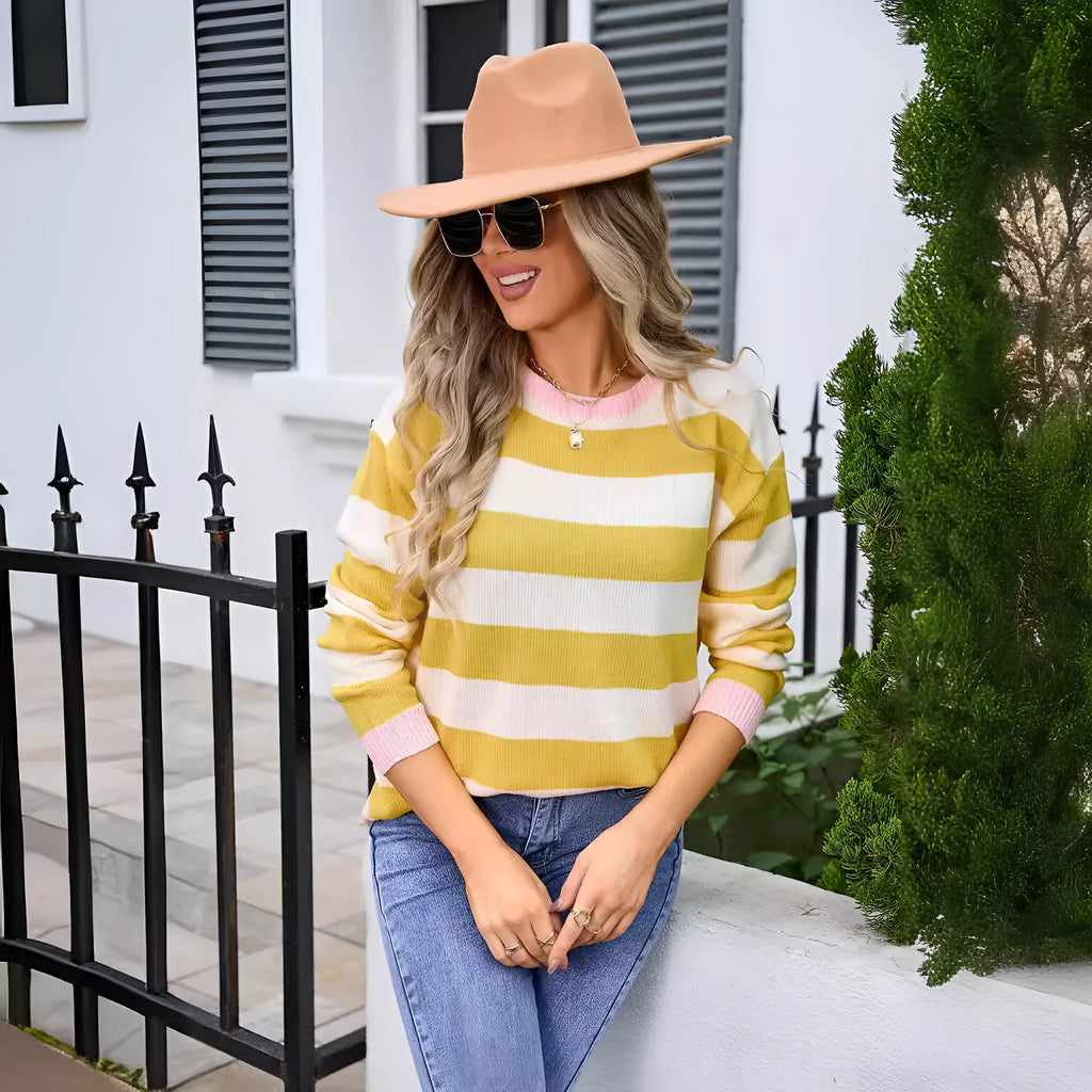 Women's loose fit long sleeve acrylic sweater in striped or plaid pattern