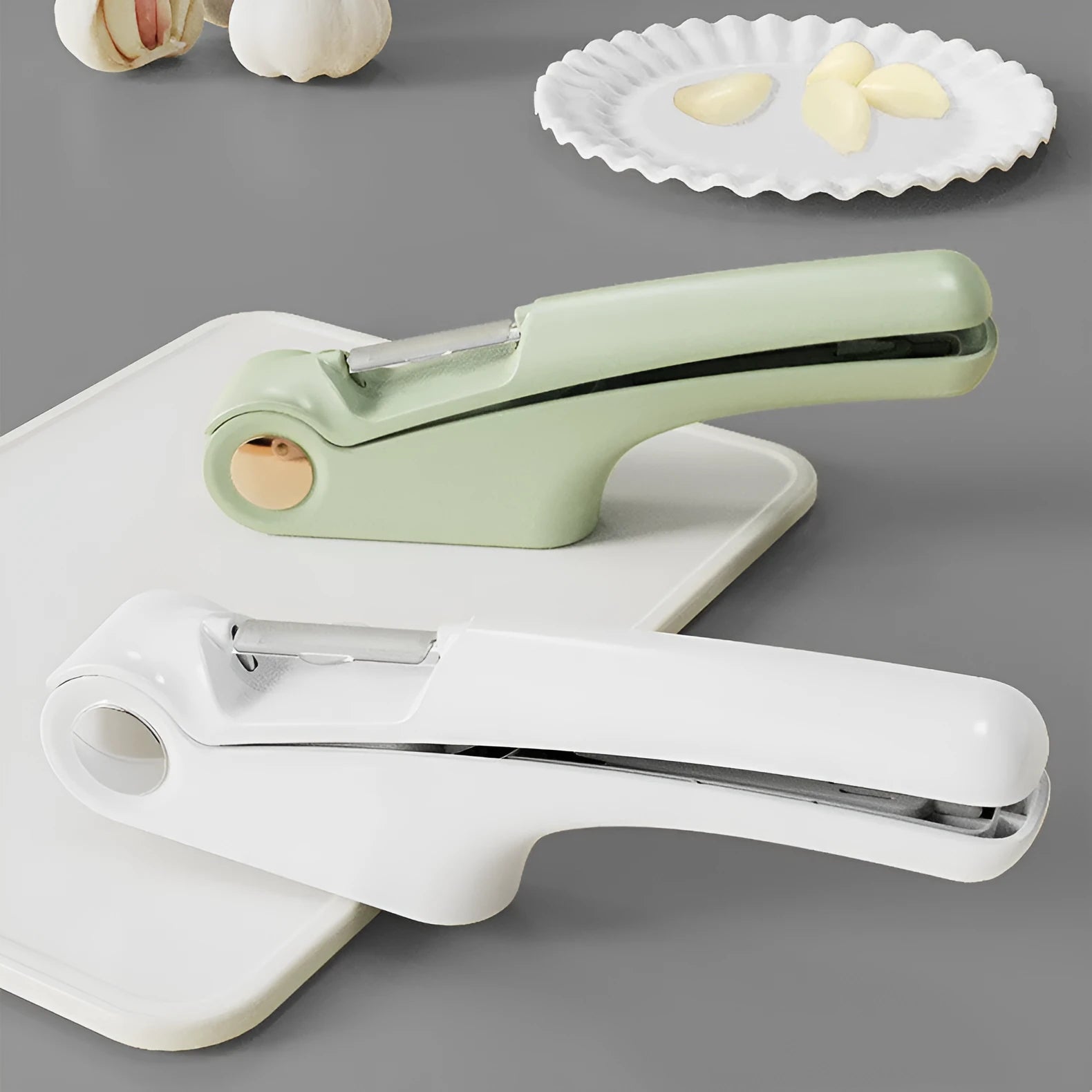 Manual garlic press in white, green, or orange with ABS and stainless steel construction