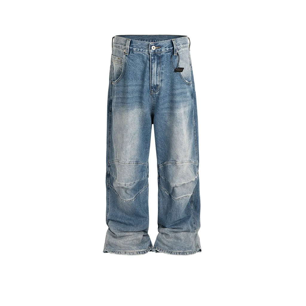 Men's straight leg baggy jeans in a washed blue denim colour with a zip fly.