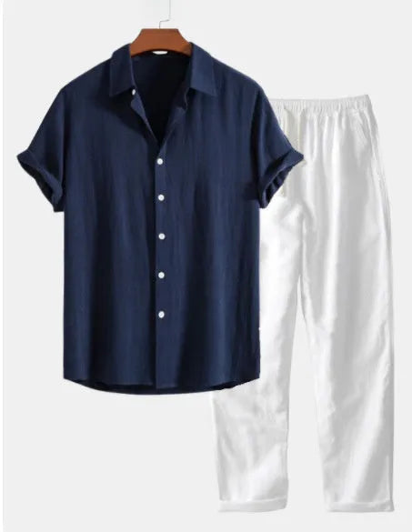 A navy blue casual short sleeve suit set with a loose-fitting shirt and shorts on a beach background.
