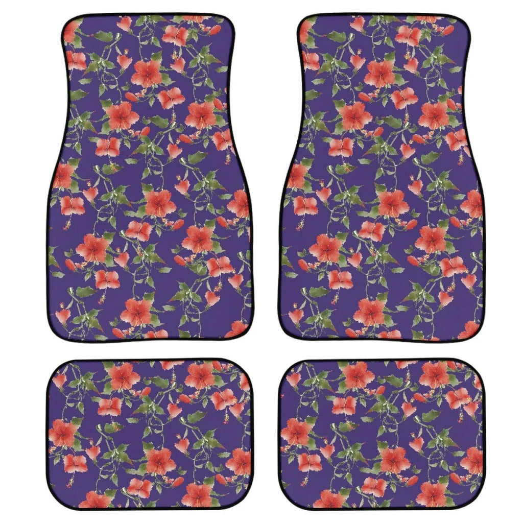 Four-piece set of black printed rubber car floor mats with textured surface.