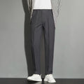 Men's straight-leg ankle-length suit trousers in apricot colour showing business gentleman styling with lightweight draping effect