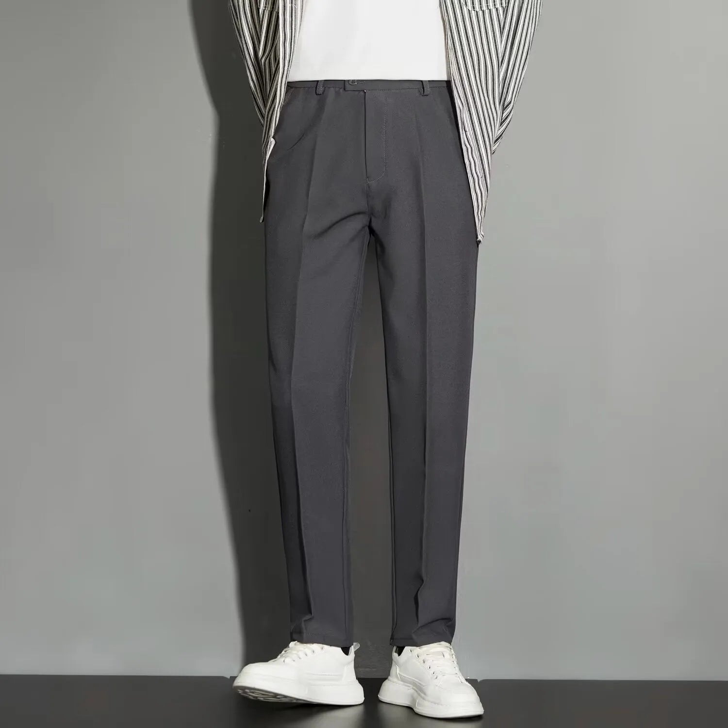 Men's straight-leg ankle-length suit trousers in apricot colour showing business gentleman styling with lightweight draping effect