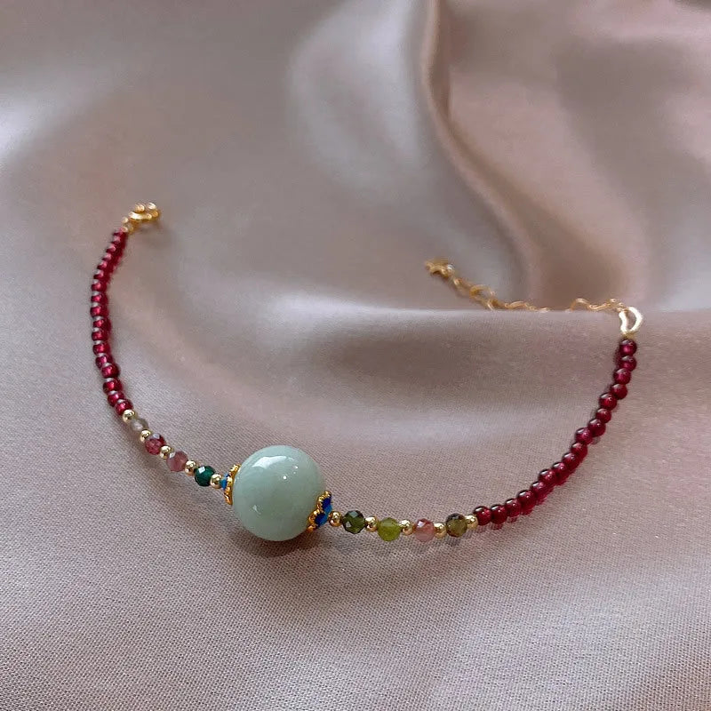 Women's Chinese style bracelet with garnet colour, drop-shaped tourmaline stones and electroplated finish